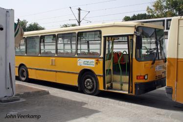 Bus side view showing front entry Bus side view showing front entry