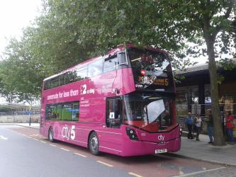 Bus with pink livery of Route 5