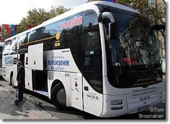 Bus side view showing luggage storage area Bus side view showing luggage storage area