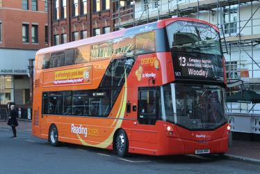 Double decker bus in orange livery Double decker bus in orange livery