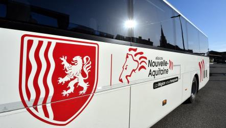 Side view of bus with logo
