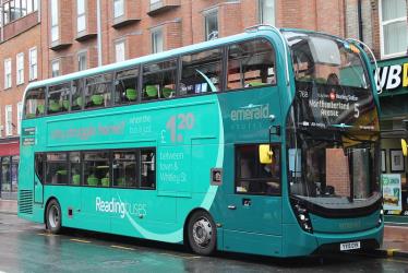 Double decker bus in emerald livery