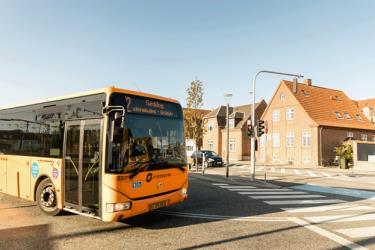 Yellow City Bus front and partial side view