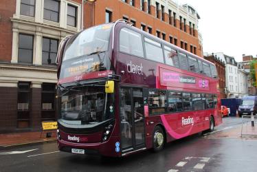 Double decker bus in claret livery